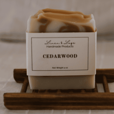 a bar of cocoa and white swirl Cedarwood Soap made from lard and shea butter