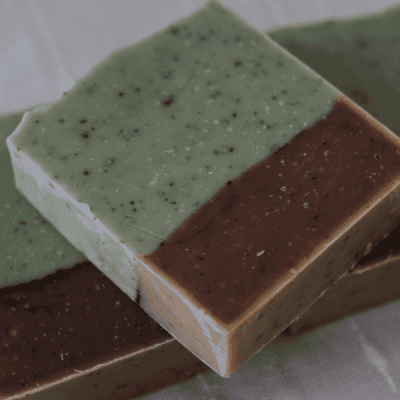 Bar of Northern Woods tallow soap - colored green and brown