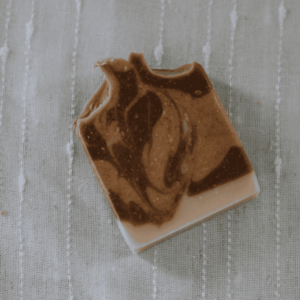 Bar of brown and yellow swirl of cinnamon spice tallow soap bar