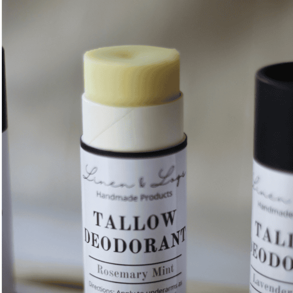 tube of rosemary mint tallow deodorant with the tip of the deodorant sticking up.