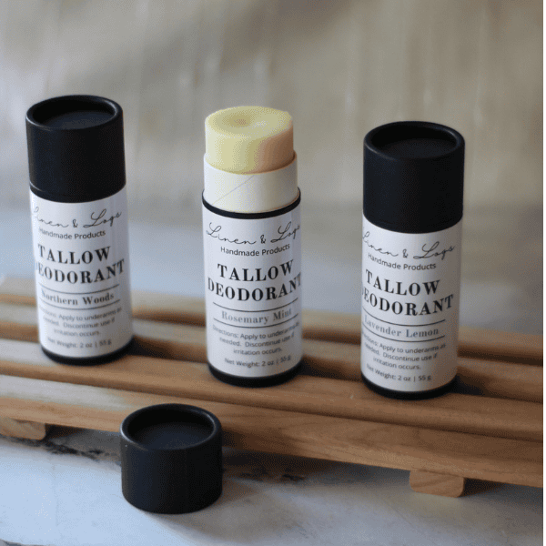 three tubes of all natural deodorant with the middle tube open showing the deodorant.