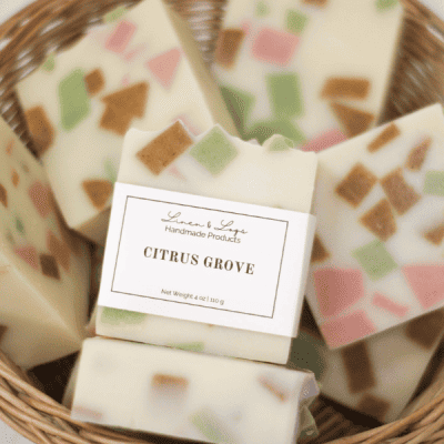 basket of citrus grove tallow soap bars - light yellow soap with chunks of orange, pink and green