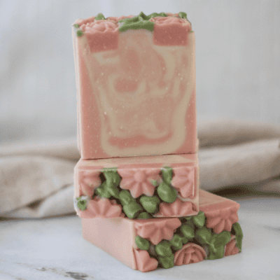 3 bars of lemongrass and lavender tallow soap - pink and white swirl with pink flowers and and green leaves