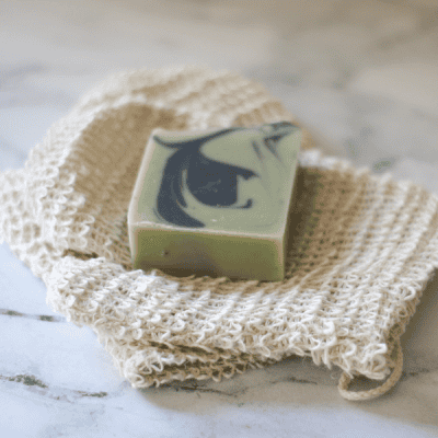 sisal shower glove with bar of soap on it