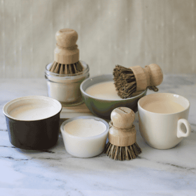 collection of vintage dishes filled with Linen & Logs Solid Dish Soap made with coconut oil, lard, and castor oil.