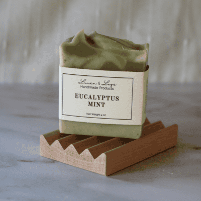 eucalyptus mint tallow soap bar standing on soap dish