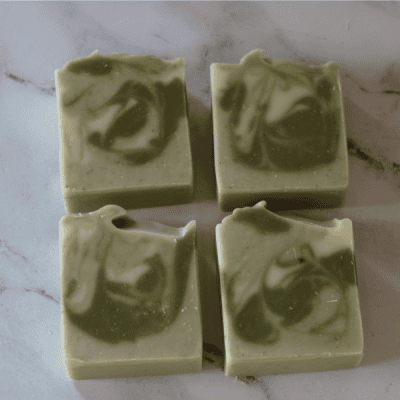 eucalytpus mint soap four bars of eucalyptus mint soap bars showing green and white swirls.