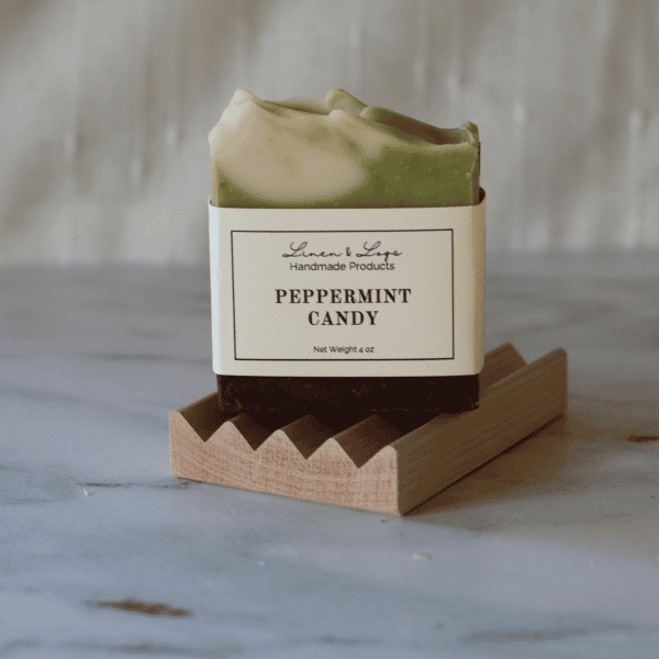 Peppermint Candy tallow soap sitting on soap dish