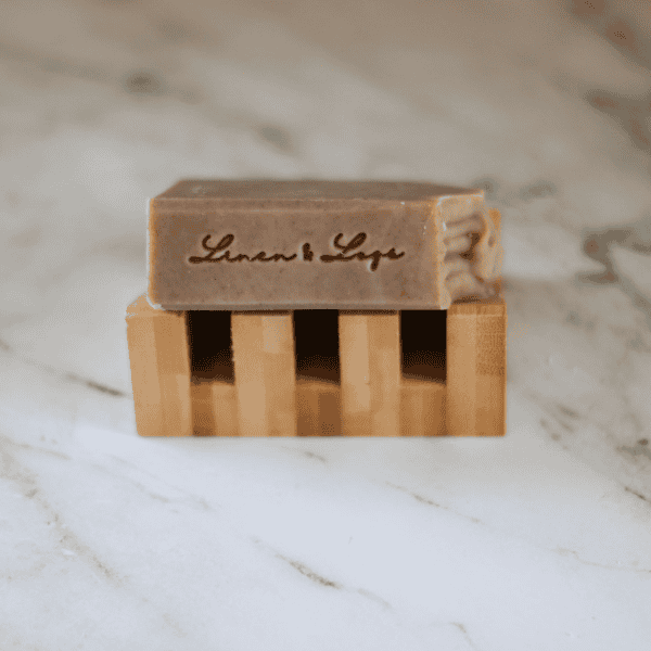 bar of lake superior sand soap with an imprint of Linen & Logs on the edge