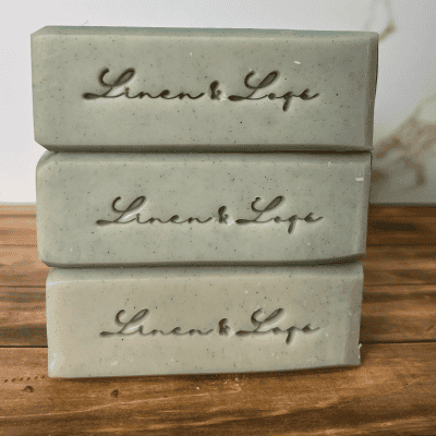 stack of linen and logs soaps showing the Linen & Logs soap stamp on the side of the soaps
