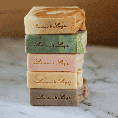 stack of linen and logs handmade soaps