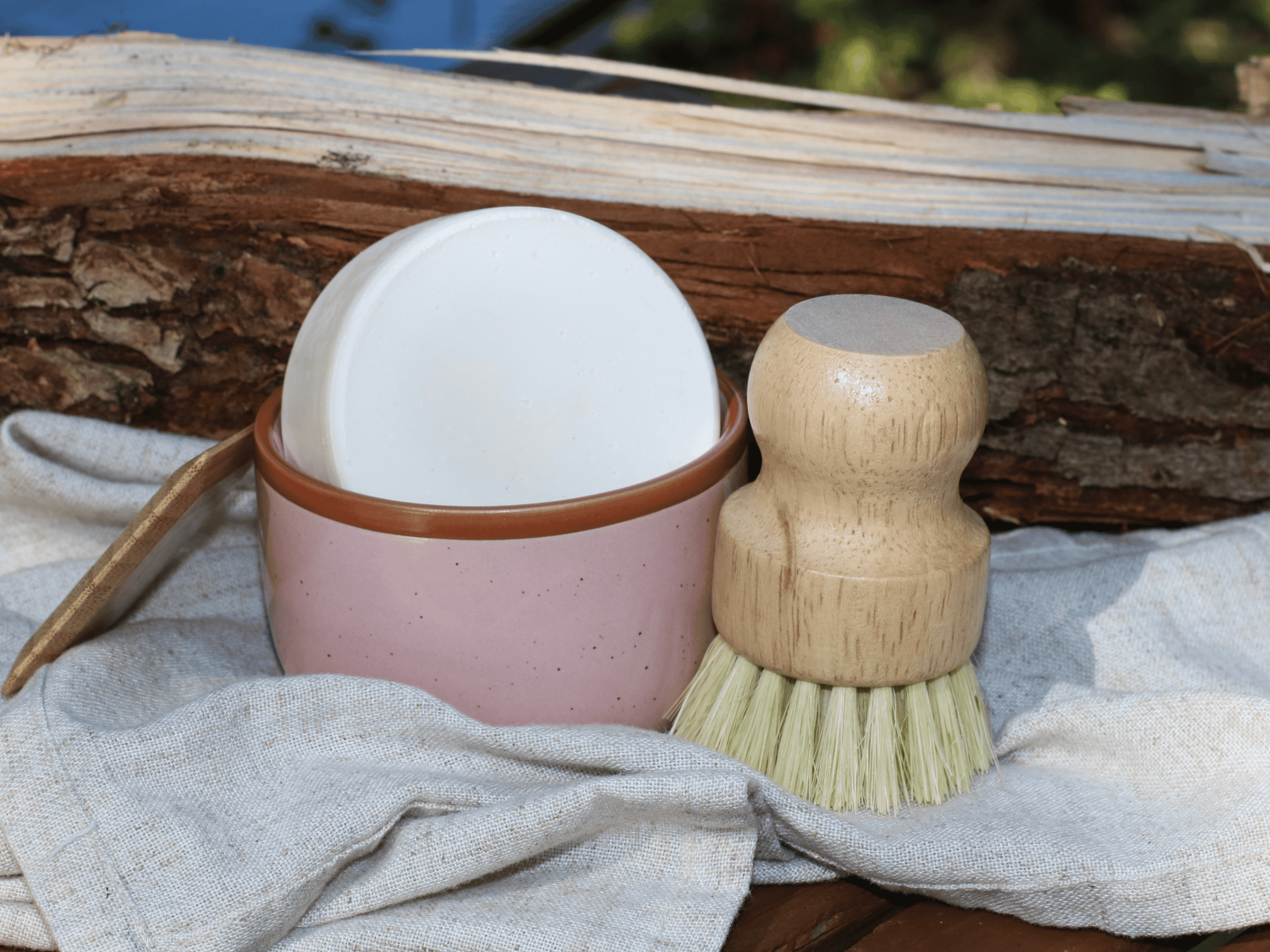 pink ramekin for dish soap bar. with dish brush and bamboo scraper.